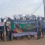 Kogi youths march in support of INEC chair Amupitan